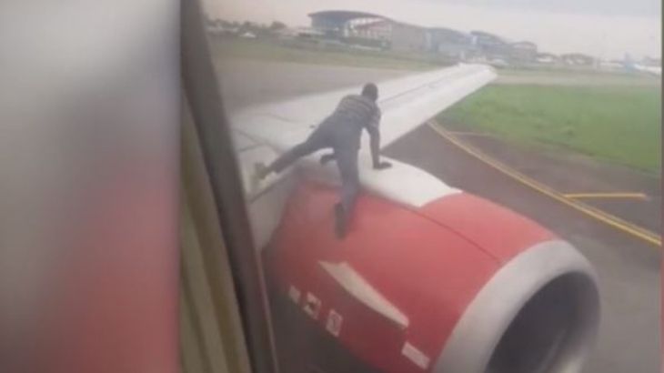 Man who jumped on plane during takeoff arrested