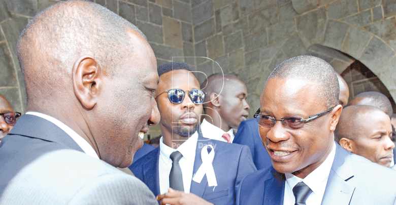 Deputy President William Ruto consoles the late Bomet Governor Joyce Laboso widower Edwin Abonyo during the memorial service at All Saints Cathedral in Nairobi.