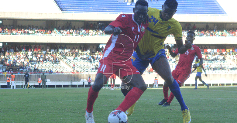 Duke Abuya (left) of Kenya challenges for the ball with an unidentified Tanzania opponent during Sunday's Africa Nations Championship qualifiers at Kasarani Stadium.