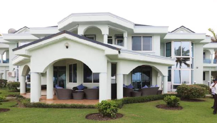 Behind a blue metallic gate, is an expansive seven-bedroom palatial home that sits atop a creek overlooking the Indian Ocean. [PHOTO | COURTESY]