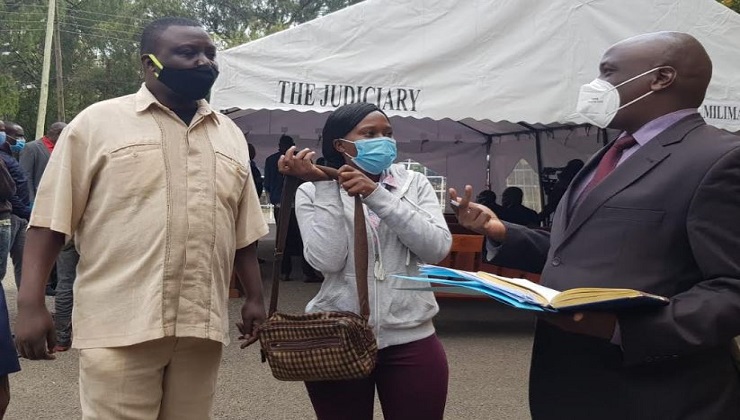 The accused Patrick Rading Ambogo (L) and Janet Magoma Ayonga (C) with their lawyer Apollo Mboya (R) at the Milimani Law Courts on Thursday, July 2. [PHOTO: SHEILA MUTUA | K24 DIGITAL]