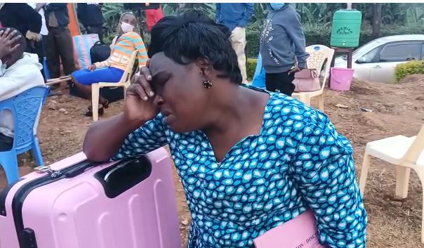 Woman cries uncontrollably after her daughter was swapped from national school in Murang’a to community school in Nyanza