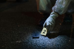 An illustration of detectives at a crime scene. PHOTO/Pexels.