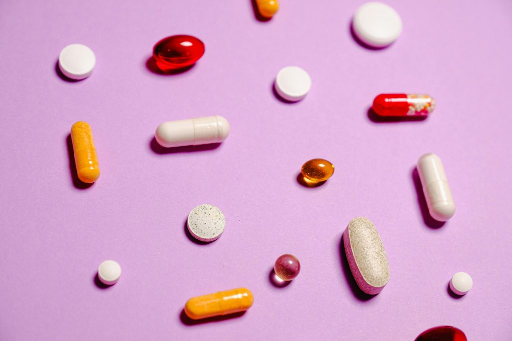 Red White and Yellow Medication Pills. PHOTO/Pexels