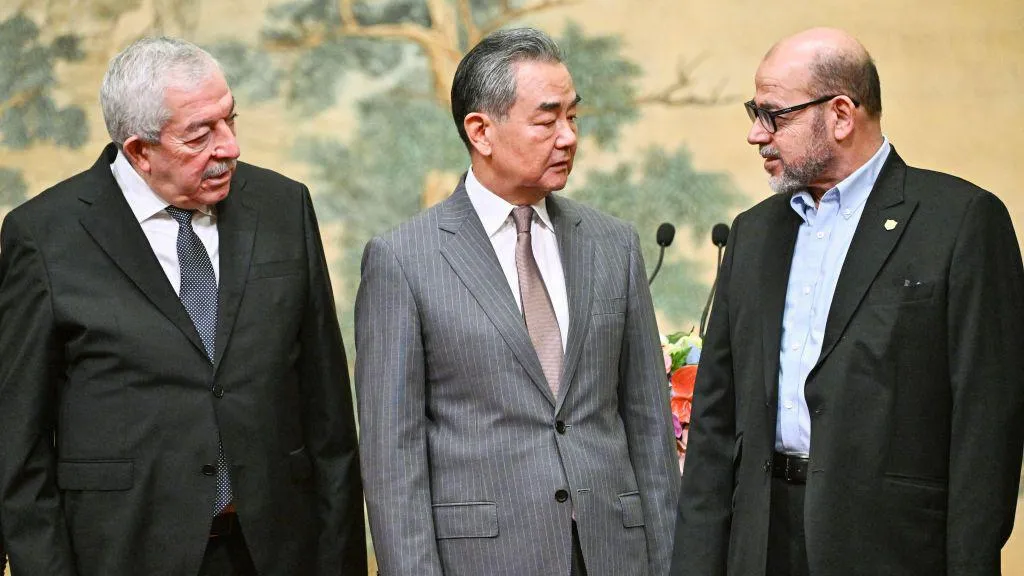 Fatah representative Mahmoud al-Aloul, China's Foreign Minister Wang Yi, and Hamas representative Mussa Abu Marzuk attended the signing of the declaration. PHOTO/Getty Images