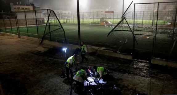 The rocket impact damaged the area around a football pitch in Majdal Shams. PHOTO/Reuters