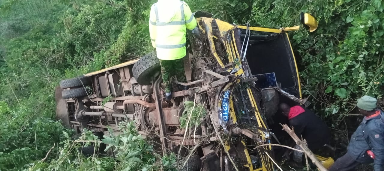 A police officer inspecting the wreckage of Olasiti Boarding primary school bus which was involved in accident at Kimwani in Nandi county. PHOTO/Isaiah cheruiyot