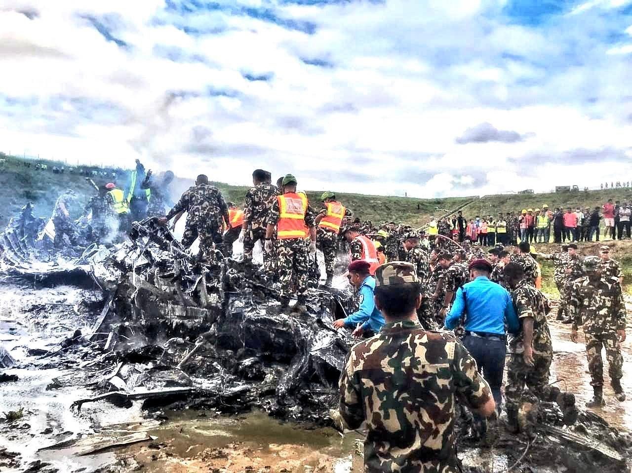 Soldiers picking up a wreckage of a plane that crashed in Nepal on Wednesday July 24, 2024. PHOTO/ @RONBupdates/X
