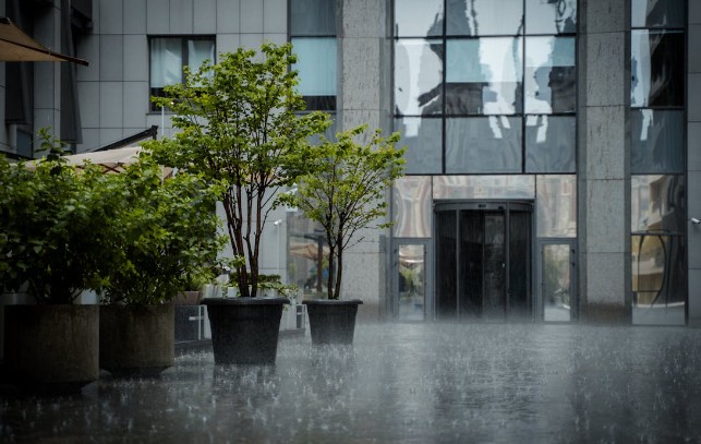 Downpour over a pavement in the city. PHOTO/Pexels