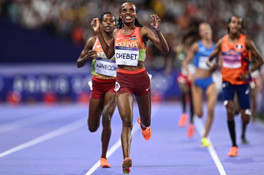 Kenya's Beatrice Chebet as she crosses the line to win gold at the Paris Olympics. PHOTO/@RailaOdinga/X