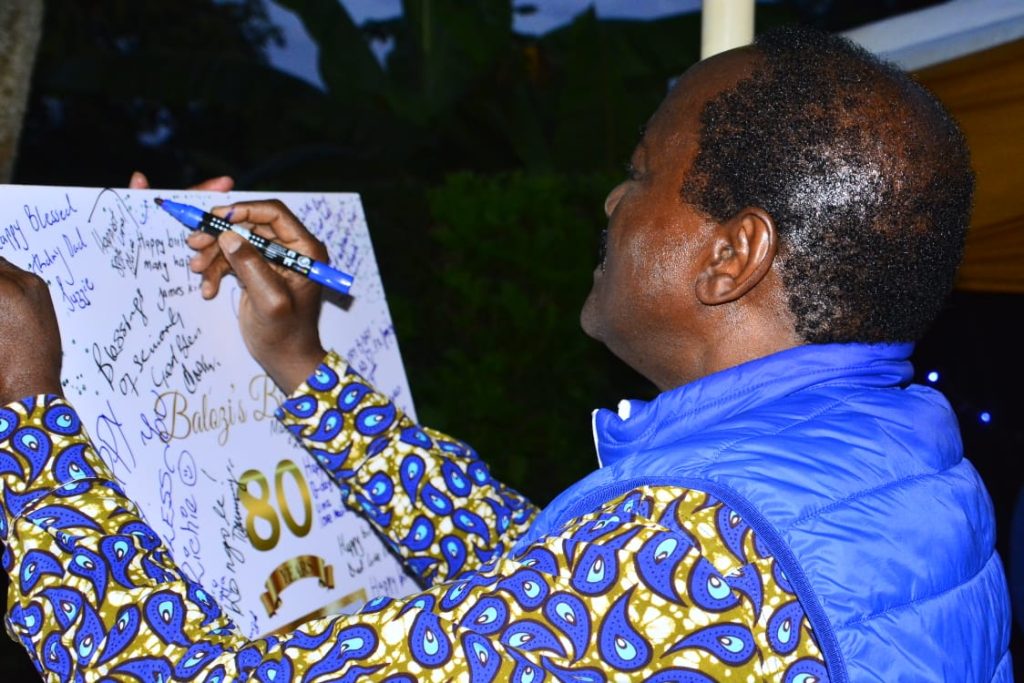 Wiper Leader Kalonzo Musyoka signing a tribute to his teacher during his 80th birthday celebrated in Embu on Saturday, August 17, 2024. PHOTO/@skmusyoka/X