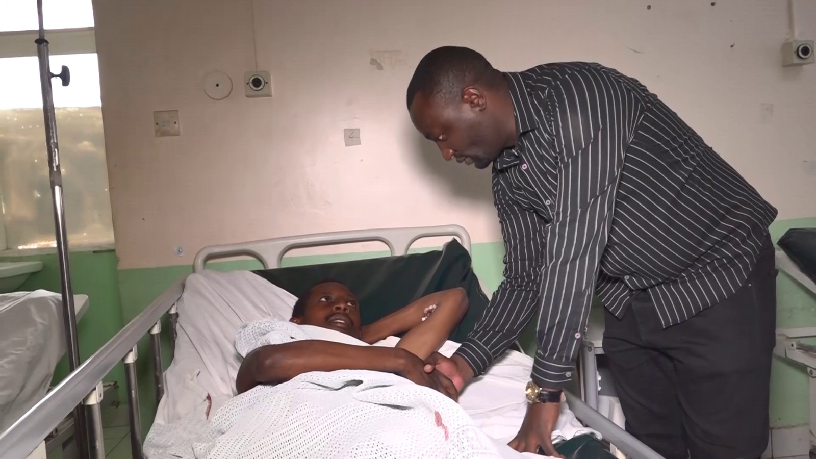 Ngoliba Ward MCA Joakim Njama when he visited the victim at Thika Level Five Hospital. PHOTO/Mathew Ndung'u