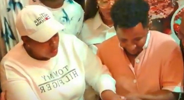 Nominated MP Sabina Chege helping Thee Pluto cut the cake during his birthday on August 29, 2024. PHOTO/Screengrab by K24 Digital