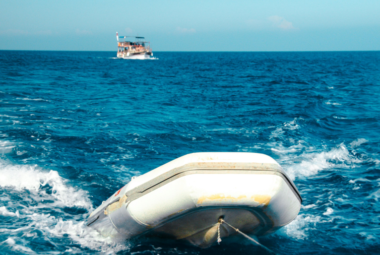 An inflatable boat tied to a string with a boat in the far end. Image used for represenation only. PHOTO/Pexels