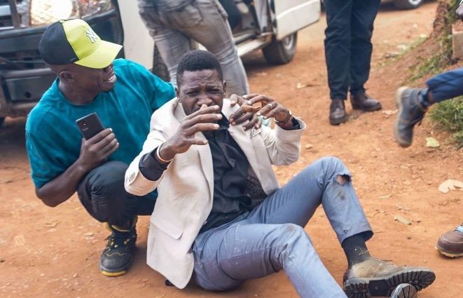 Uganda politician Bobi Wine sits on the ground after he was injured during a fracas with police officers on September 3, 2024, in Bulindo town. PHOTO/@HEBobiWine/X