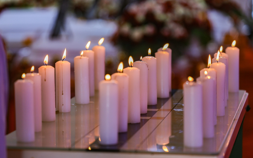 Candles lit during the memorial service of Endarasha fire victims on Thursday September 26, 2024. PHOTO/@rigathi/X