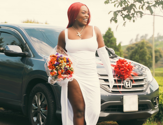 Maandy poses next to her newly acquired Honda CRV on Wenesday, October 9, 2024. PHOTO/@maandygram/Instagram