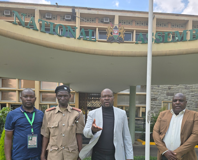 Misheveve chief Protus Wechuli of Saboti location, Trans-Nzoia County at Parliament Buildings with Saboti MP Caleb Amisi on Tuesday, October 22, 2024. PHOTO/@Honcalebamisi/X