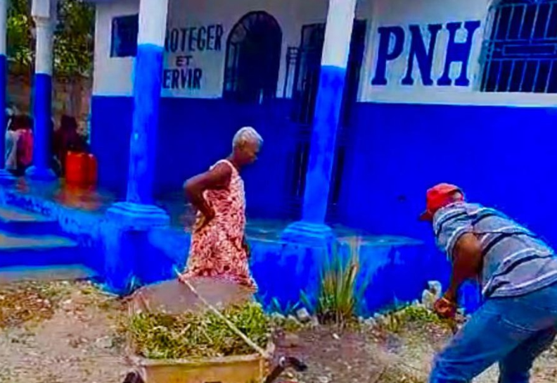 Locals clean the Liancourt Police Station in Haiti