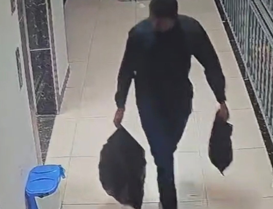 CCTV snippet of a person carrying bags believed to be carrying the remains of a woman reported missing. PHOTO/@DCI_Kenya/X