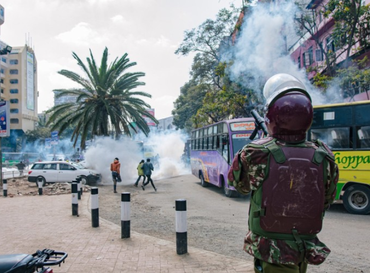 A police officer lobs teargas on protesters in Nairobi on July 24,2024. PHOTO/@SemaUkweliKenya/X
