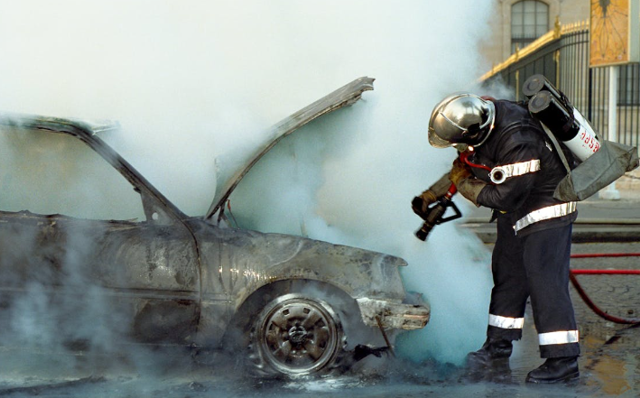 A fireman extinguishes fire on a damaged car. Image used for representation. PHOTO/Pexels