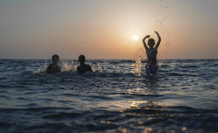 A silhouette of children playing in the water. Image used for representation. PHOTO/Pexels