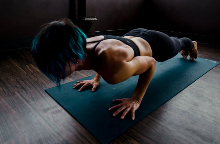 A woman doing push-ups on a mat. Image used for representation purposes only. PHOTO/Pexels 