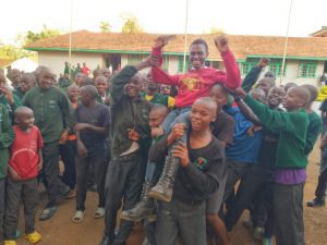 Muthoni Caleb Ng'ang'a celebrates with his colleagues on Friday, January 10, 2025 after emerging the top 2024 KCSE student at Kangaru School. The results were released by the Ministry of Education on Thursday, January 9, 2025. PHOTO/Brian Malila