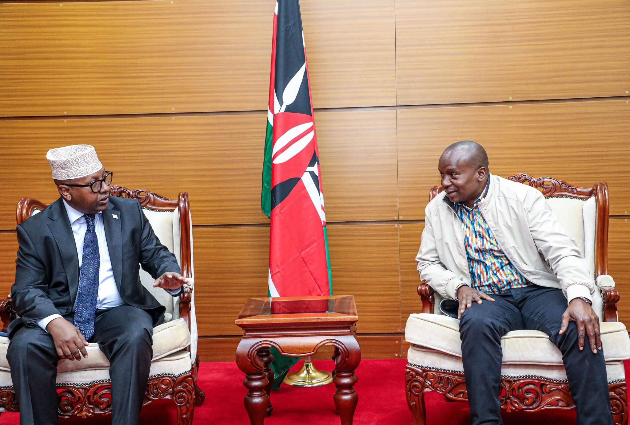 Kithure Kindiki engages Somalia's foreign minister after they crossed paths at the Jomo Kenyatta International Airport on Wednesday, January 15, 2025. Kindiki was en route to Maputo for the inauguration of their new president, Daniel Chapo. PHOTO/https://www.facebook.com/KithureKindiki