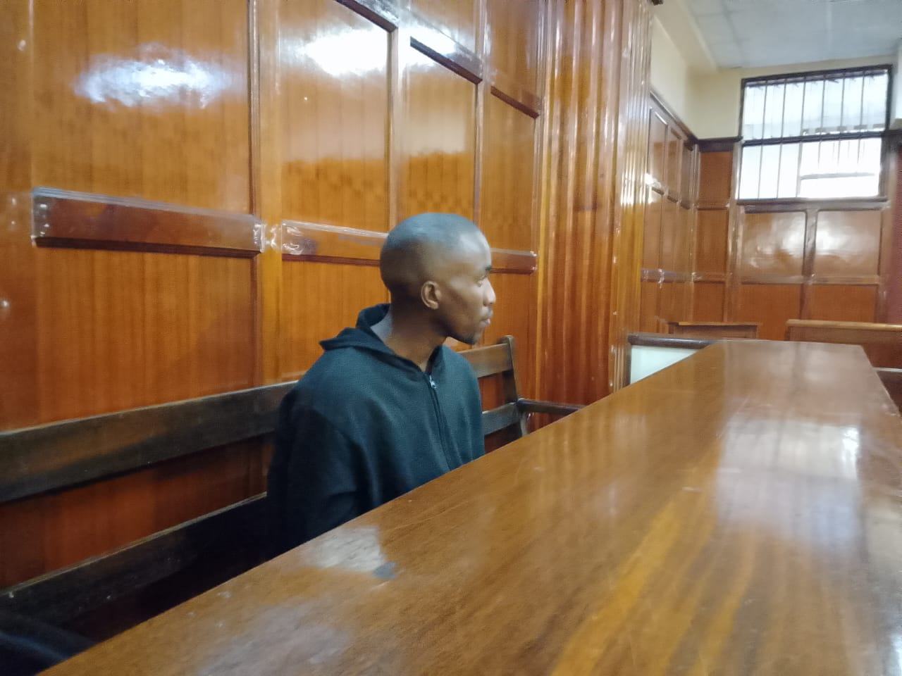 Murder suspect John Kyama Wambua who is accused of killing his wife Joy Fridah Munani in Huruma, Nairobi County, when he appeared before Senior Principal Magistrate Gilbert Shikwe at Milimani Law Courts. PHOTO/Zipporah Ngwatu