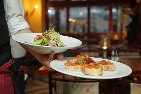 A waiter's hand with food. Image used for representation purposes. PHOTO/Pexels