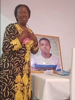 Brian Chira's granny with his photo. PHOTO/Screengrab by K24 Digital of TikTok video by @shoshoyachira