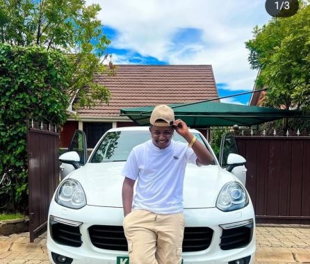 Thee Pluto posing next to his car on March 7, 2025, hours after buying it. PHOTO/@theepluto/Instagram.