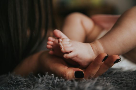 A mother holding her child's feet. Image used for representation purposes. PHOTO/Pexels