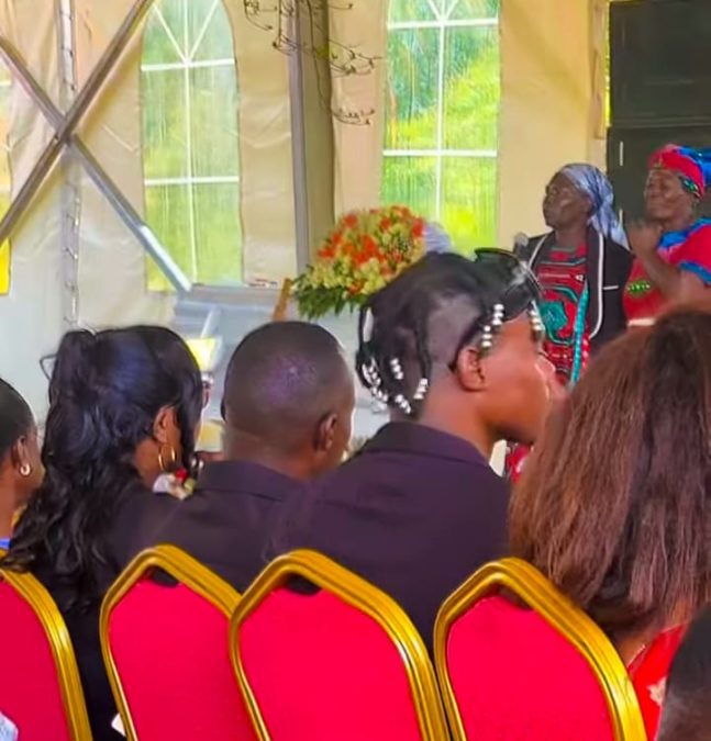 Guests seated next to a white casket at the burial of Eko Dydda's mum. PHOTO/@2mbili/Instagram