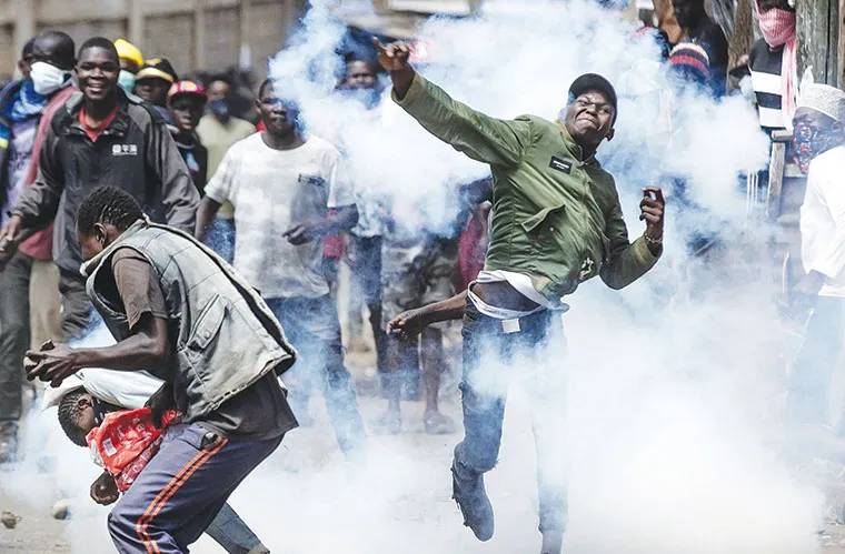 A photo of protestors engaging police. PHOTO/https://www.facebook.com/photo/?fbid=122115515492896378&set=pcb.1978015162602264