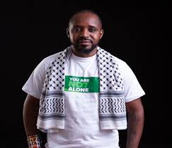 Boniface Mwangi posing for a photo PHOTO/@bonifacemwangi/X