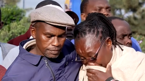 A photo of Boniface Kariuki's aunt being comforted by his father during a presser. Screen grab by K24 digital from Citizen TV