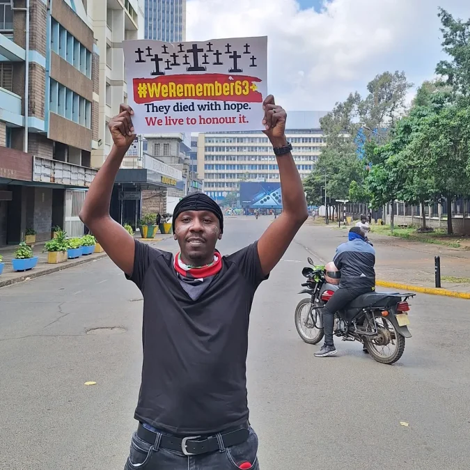 Veteran gospel DJ Krowbar holding placard during a past demontration. PHOTO/@djkrowbar/Instagram