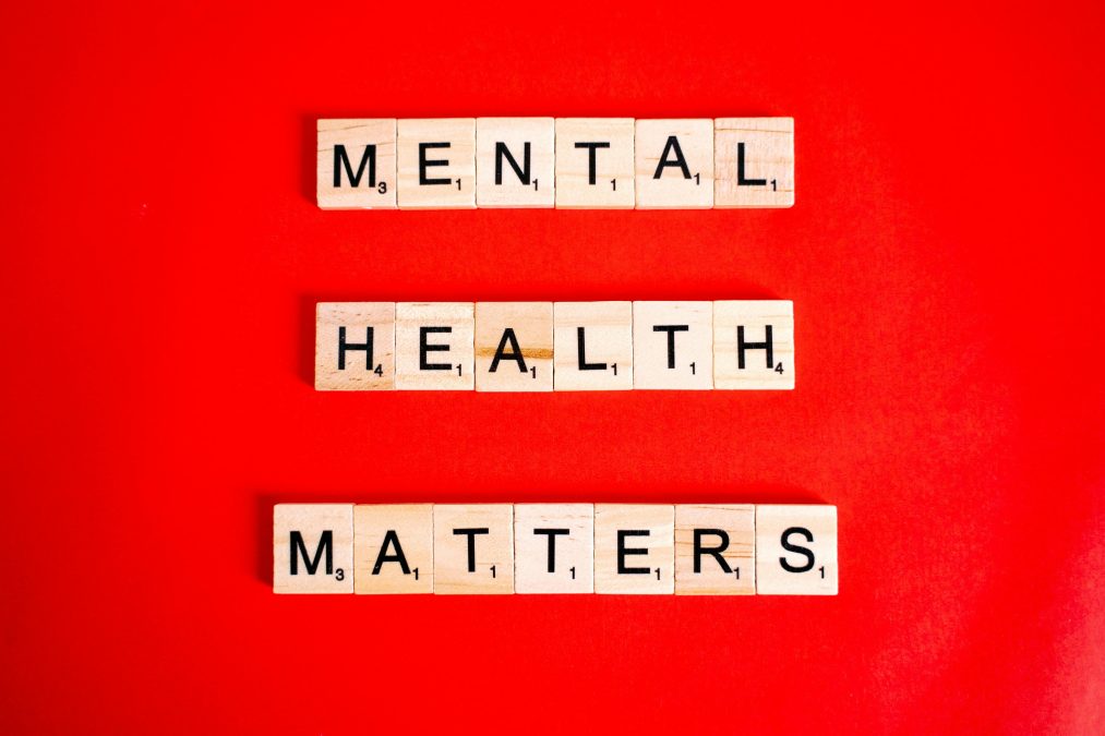 Mental Health matters spelt on letter tiles advocating for mental health awareness