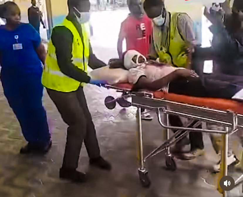 The bleeding protester being whsiked inside KNH. PHOTO/Screengrab by K24 Digital of X video by @allanschoy