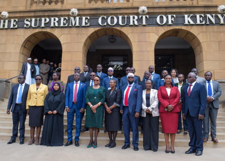 New IEBC commissioners with Chief Justice Martha Koome and other government officials after being sworn in to office.