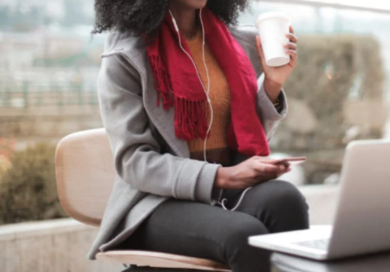 A woman drinking coffee while working. Image used for illustration purposes. PHOTO/Pexels