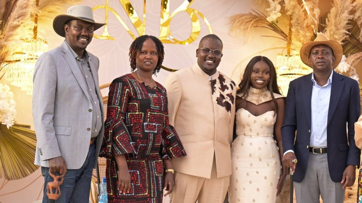 Oscar Sudi and Uasin Gishu Senator Jackson Mandago pose for a photo with the couple of the day, Brian Belio and Nicole Langat. PHOTO/https://www.facebook.com/riftvalleypoliticske