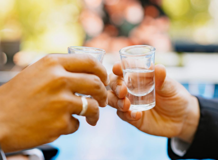 Hands holding shot glasses, image used for representation purposes. PHOTO/Pexels