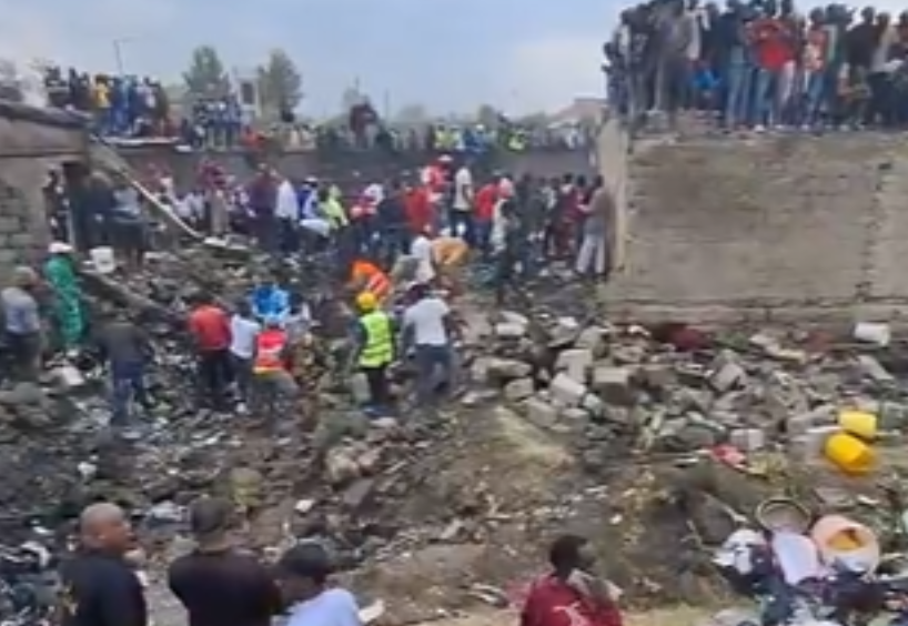 Residents gathered at the scene of the crash after fire was put out. PHOTO/Screengrab by K24 Digital from video posted by People Daily Digital