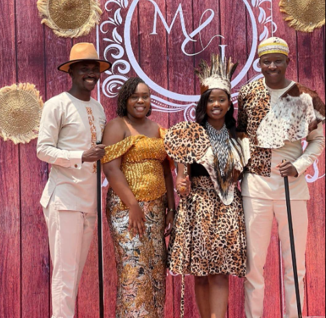 Marya Okoth, her groom and friends posing. PHOTO/https://www.facebook.com/grannie.kokeyo