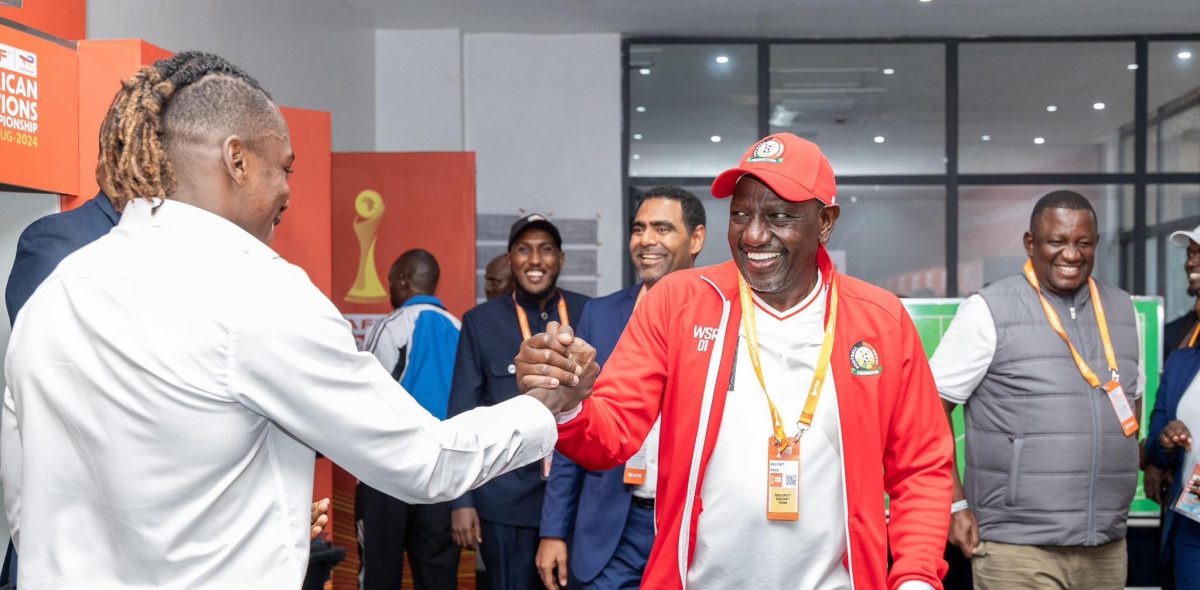 President William Ruto chats with one of Harambee Stars' player after CHAN match. PHOTO/https://www.facebook.com/williamsamoei