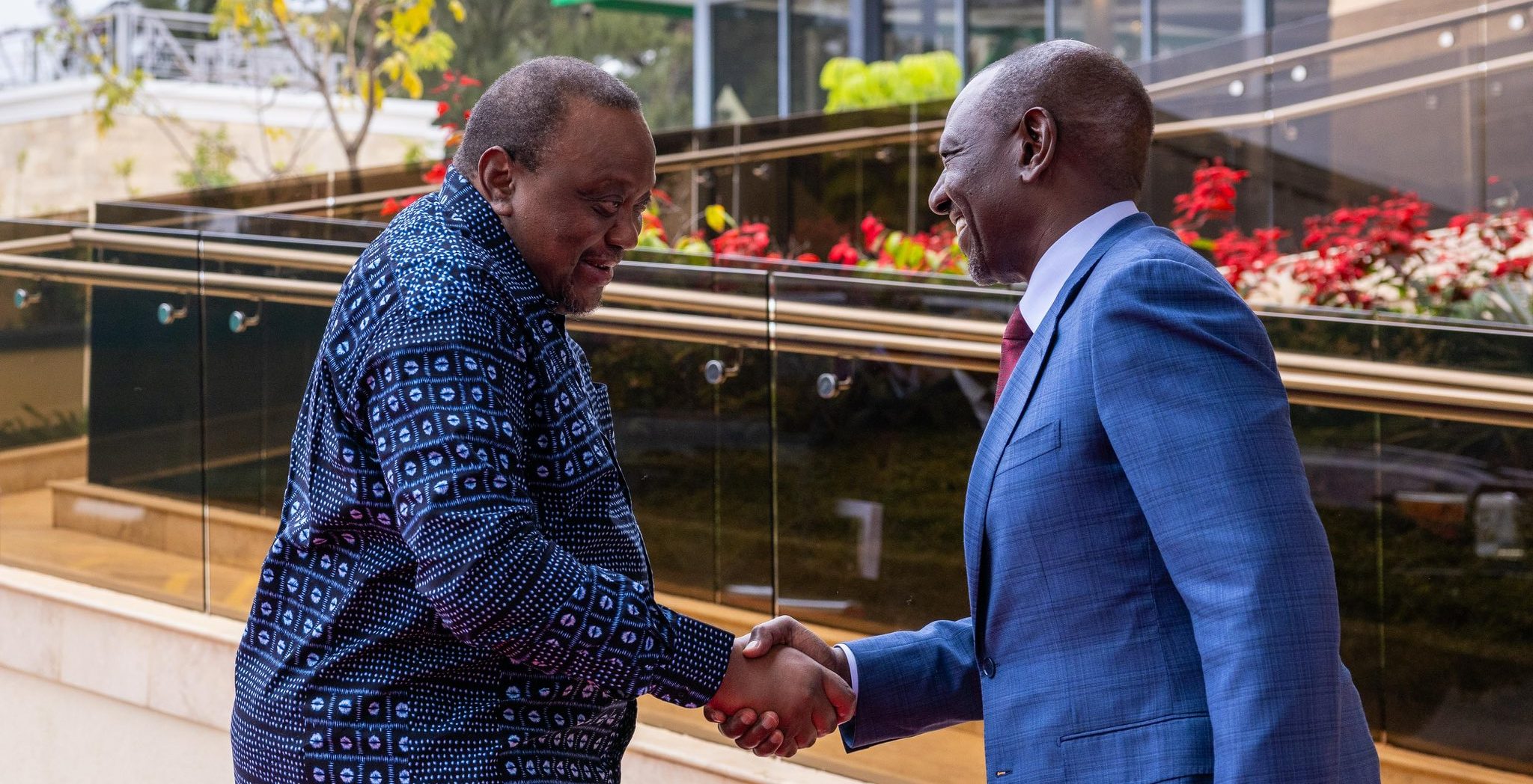 President William Ruto and former President Uhuru Kenyatta shake hands. PHOTO/@OliverMathenge/X